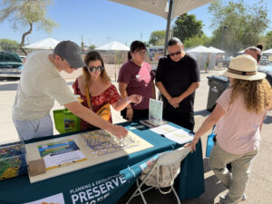 People participating in rubber band public response activity. Event for Phoenix Light Rail opening.