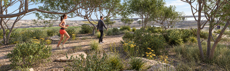 Shaded desert path with people walking and running along it.